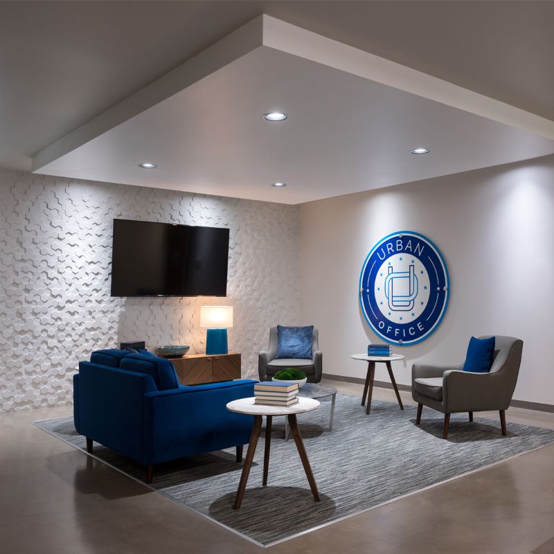 Couch, tv and chairs in Century Heights property from Urban Office