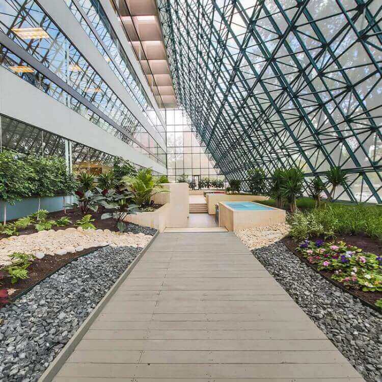 Walkway by glass windows in Century Heights property from Urban Office