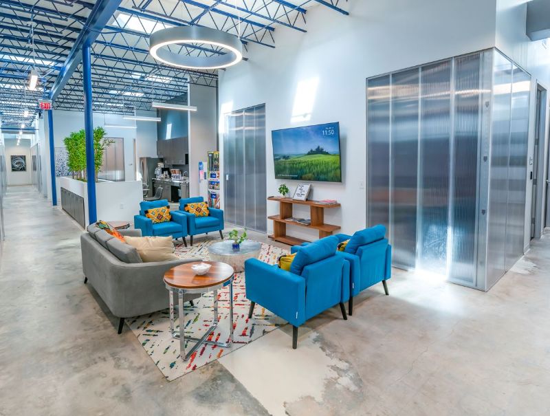 Relaxed lounge area inside Urban Office's Spring Branch Village location in Houston, Texas