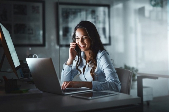 A Woman uses her Laptop Working at a Dedicated Desk in Houston, TX