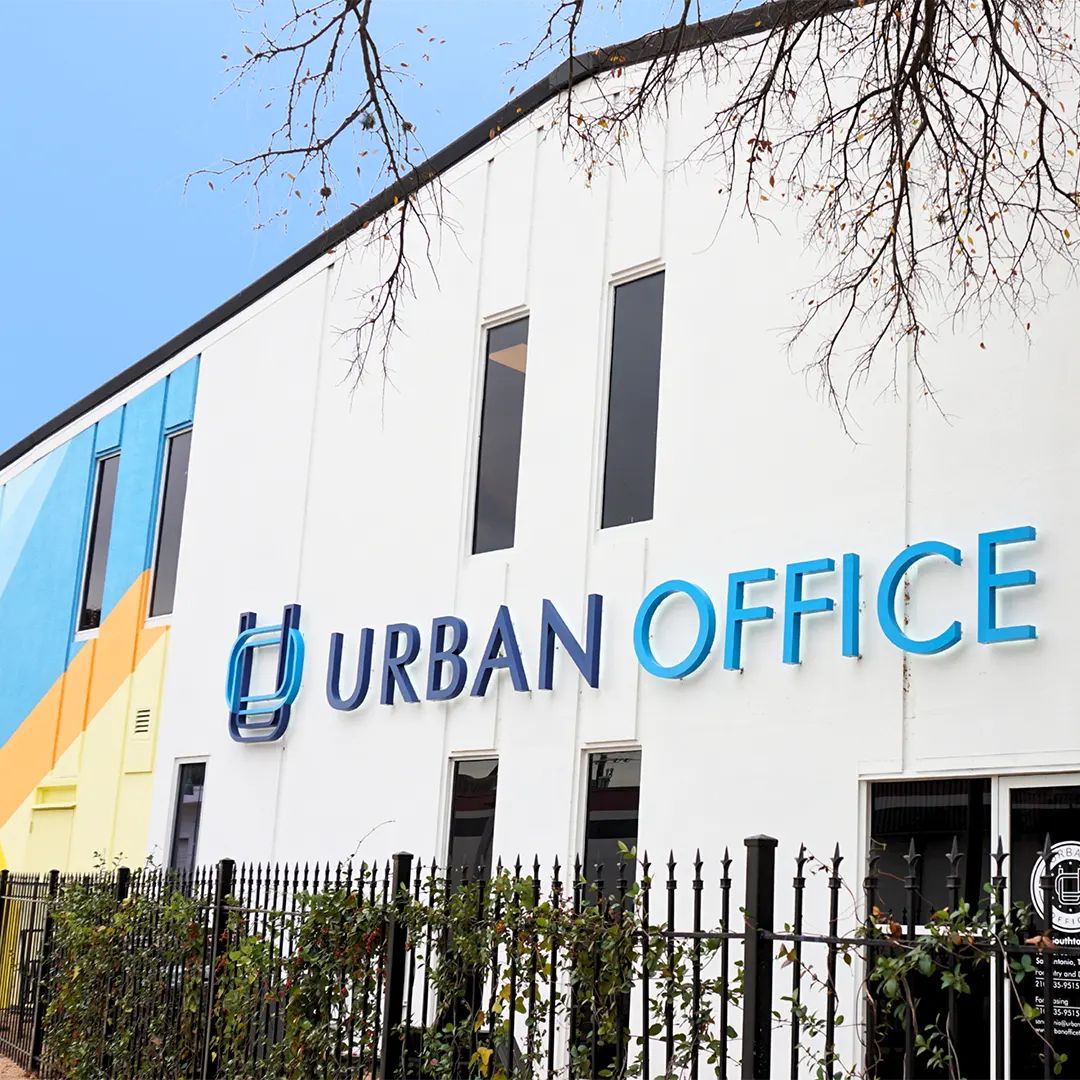 Urban office with blue and white sign offers convenient, private office space in San Antonio, TX