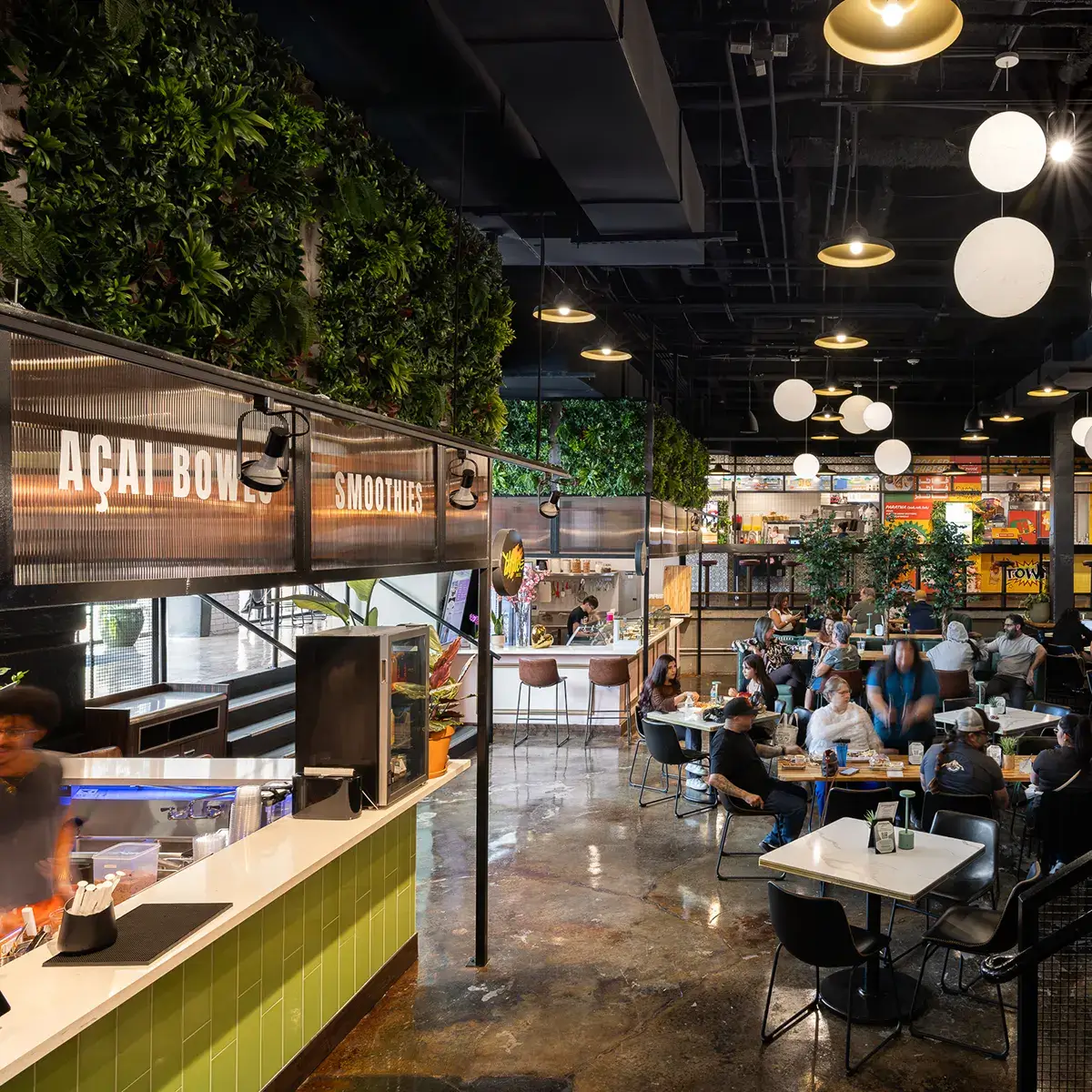 Dining hall in open office facility at 53 West in Houston, Texas