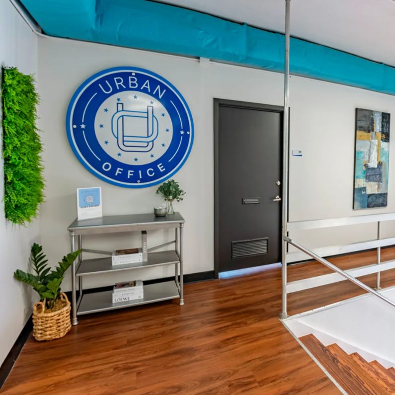 Urban Office space with wooden floors and green plants in Houston, TX