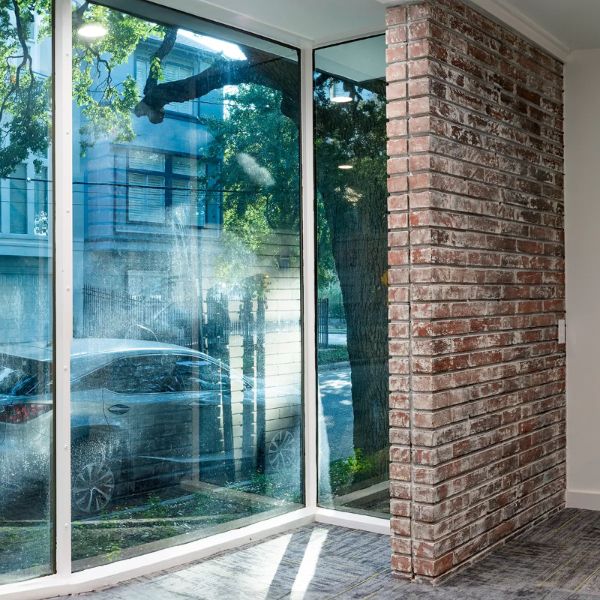 Brick wall and glass door in an office environment based in Houston, TX