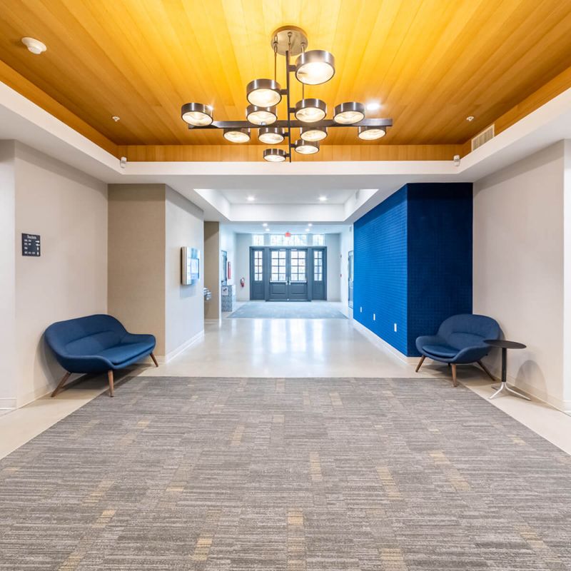 Hallway with round Chandelier Lighting at Urban Office in Austin, TX