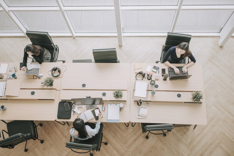 View from above of women working at desks by Urban Office in Houston and San Antonio