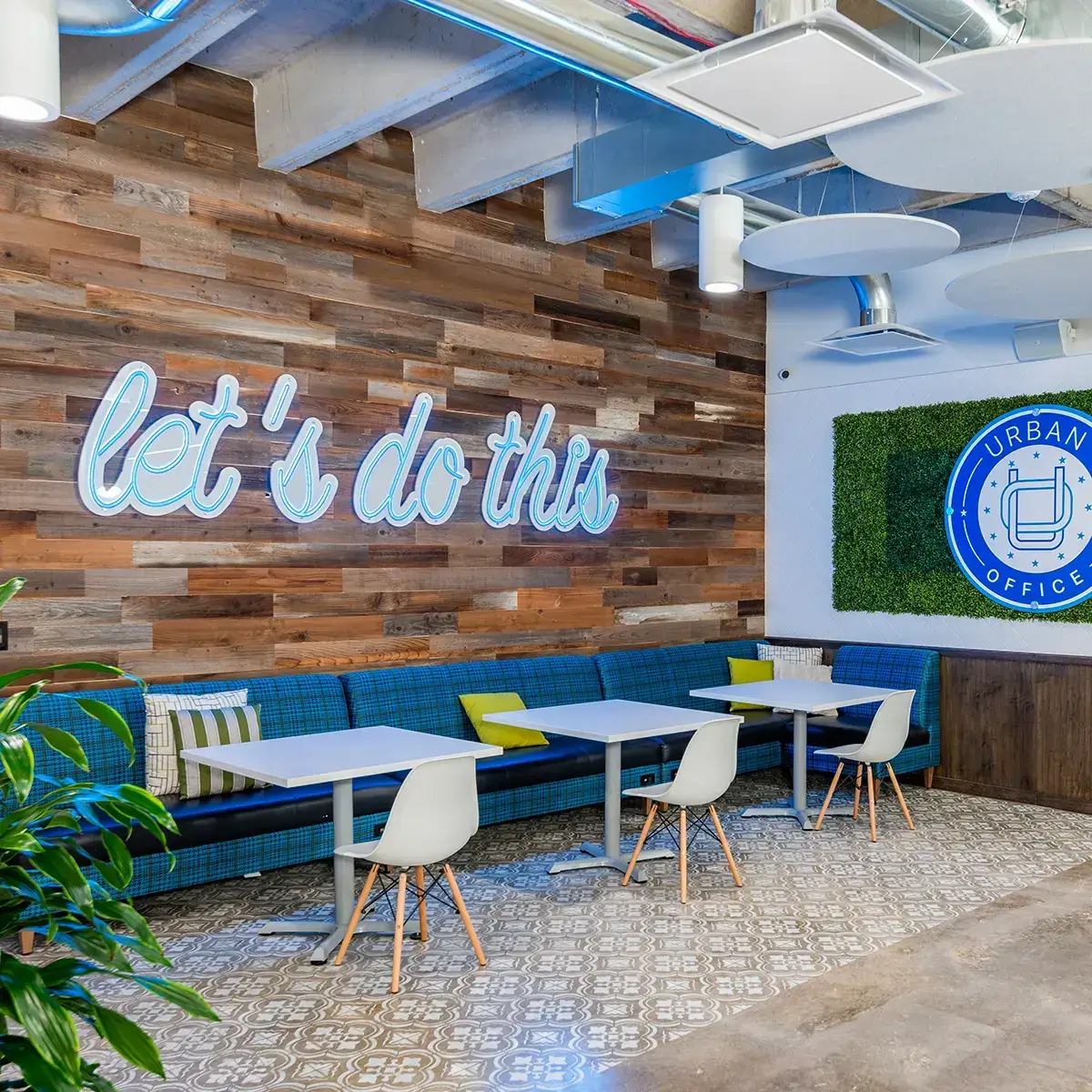 Bright, flexible private office space with a blue couch located in Tanglewood, Houston, TX