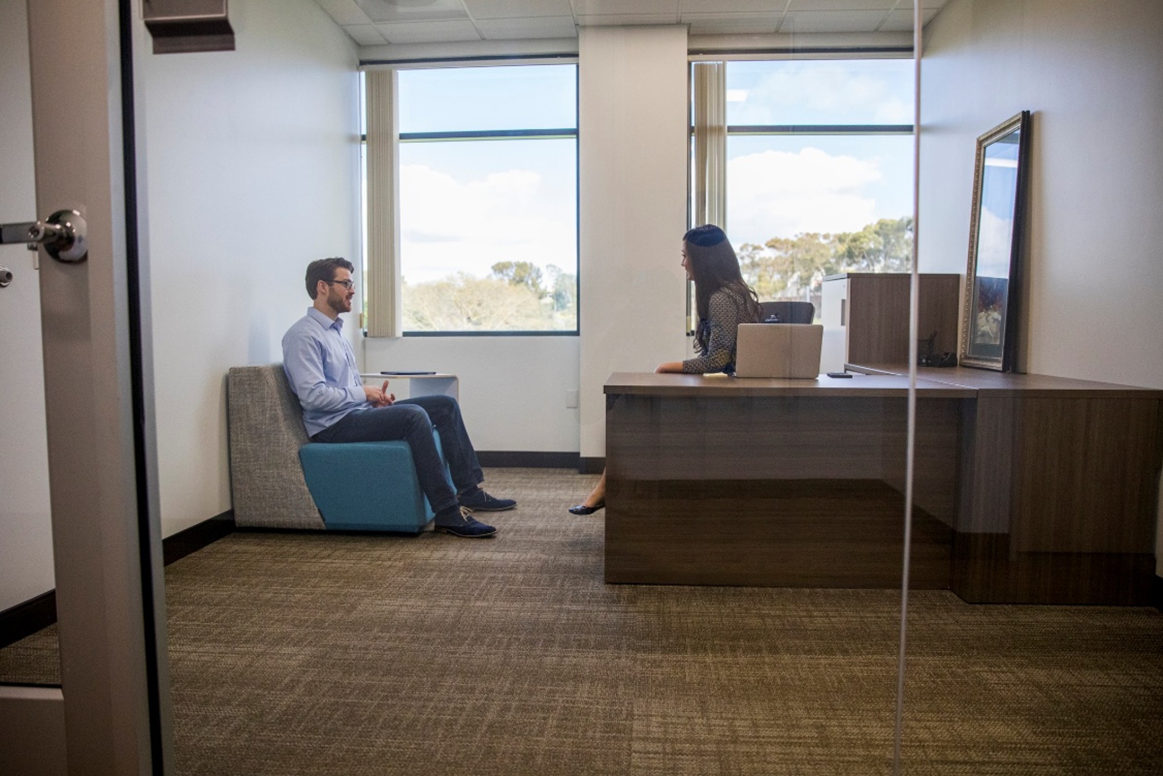 Private office setting suitable for therapists and confidential client consultations.