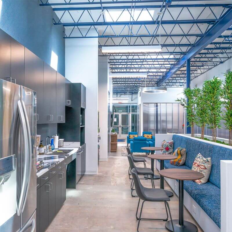 A kitchen area with a comfortable sitting space in Spring Branch Village, Houston, TX