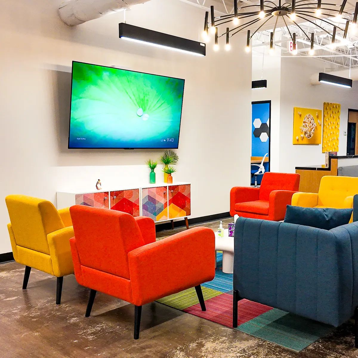 Brightly colored room with colorful chairs and a large flat-screen television in Texas