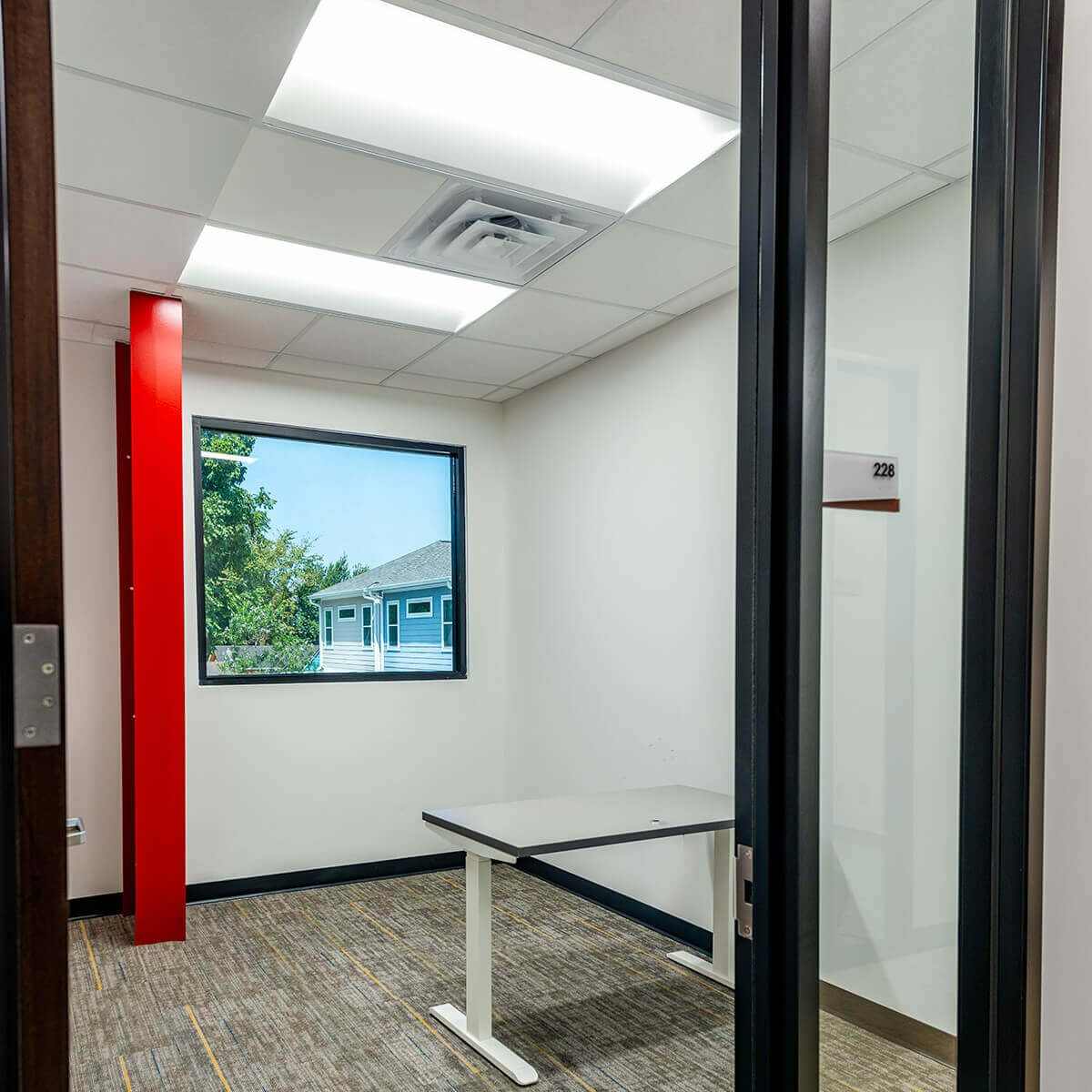An Office Space Showcasing a Desk Adjacent to the Window in Houston, TX