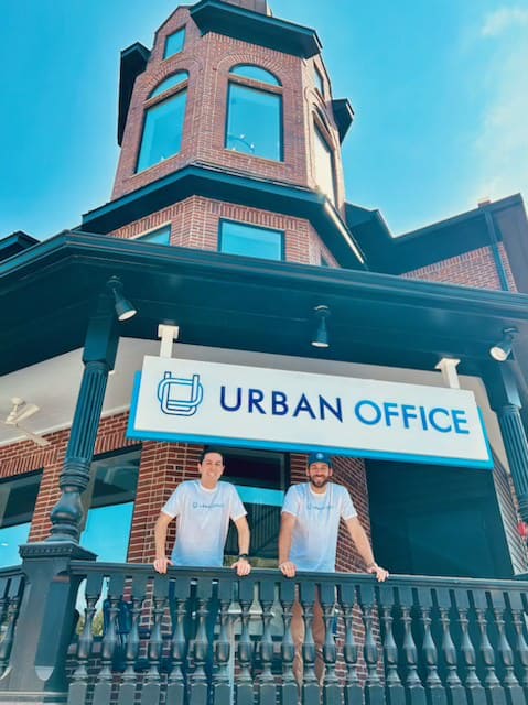 Two people standing in front of Urban Office in Houston & San Antonio