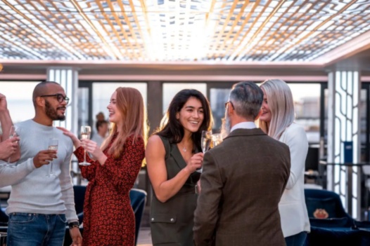 Bonding with coworkers at a happy hour at an Urban Office space