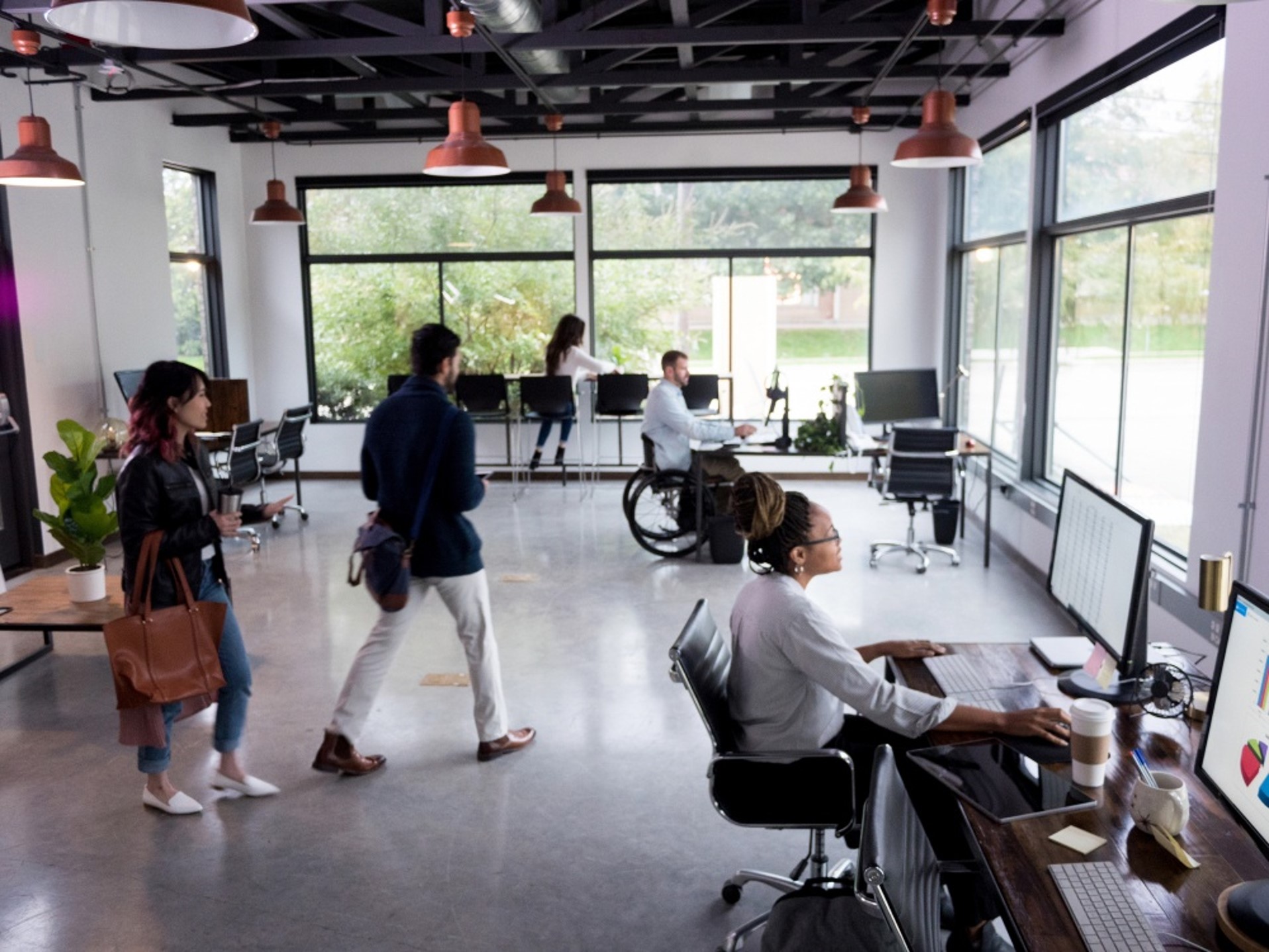 Modern coworking office with professionals working in a flexible shared workspace.